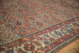 Wide ivory Herati border beside the oxidized silver and red allover field of a vintage Mahal.