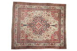 Antique Kerman square carpet with a central roundel medallion in sapphire blue and red on an ivory ground.