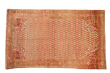 Distressed vintage Malayer rug with germinating blossoms and boteh contours in red, ivory, and tangerine orange.