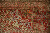 Pomegranate corner spandrel in tangerine orange on a vintage distressed Malayer rug.
