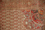 Pomegranate corner spandrel in tangerine orange and red on a vintage distressed Malayer rug.