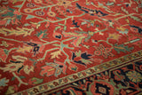 Heriz rug's red field, intricate vines, geometric blossoms, and Turtle Samovar border.