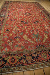 Vintage Heriz carpet's navy blue main border with a reciprocating Turtle Samovar motif.