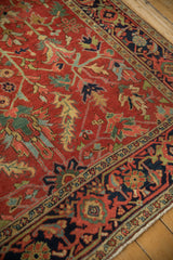 Intricate navy blue border with reciprocating Turtle Samovar design on a vintage Heriz carpet.