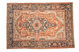 Hand-knotted Antique Serapi carpet, brick red medallion, navy floral border, mostly even wear.