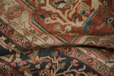 Antique Serapi rug's hand-knotted texture with brick red, navy, and green floral arabesques.