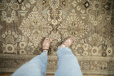 Distressed Bibikabad rug with diamond floral sprays and soft texture in neutral shades.
