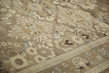 Textured pile of vintage distressed Persian Bibikabad rug showing beige and pale blue floral sprays.