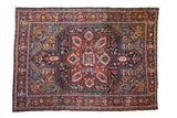 Vintage Heriz carpet, oversized center medallion, floral palmettes, deep cherry red and sapphire blue.