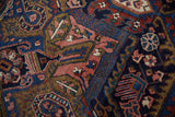 Intricate deep rose, navy, and cherry red Herati design on vintage Heriz carpet.