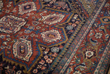 Heriz rug with rich cherry red field, floral palmette medallions, and Turtle Samovar border.