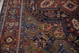 Heriz carpet border featuring Turtle Samovar and Herati motifs in deep cherry red, navy, gold.