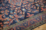 Detailed view of the fine, hand-knotted pile of a vintage Lilihan rug with scrolling arabesques.