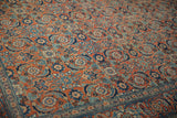 Traditional Persian Tabriz carpet: Herati pattern, Turtle Samovar border in brick red, navy, sky blue.