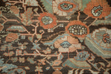 Detailed view of hand-knotted floral bouquets in tangerine, jade green, and dusty blue.