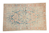 Distressed vintage Mahal rug with a floral medallion, abrashed blue field, and coral accents.