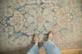 Decorative even wear on a vintage Persian Mahal rug, showing the sky blue and ruby red floral pattern.