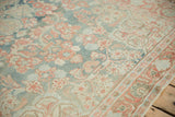Textured even wear on a vintage Mahal rug with sky blue and ruby red floral bouquets.
