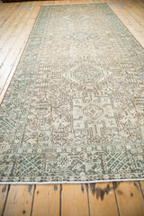 Angled perspective view down the distressed Karaja runner, showing its soft neutral color palette.