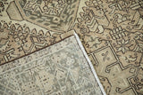 A folded corner of a distressed Karaja runner reveals its tidy hand-knotted back and low pile.