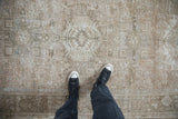 Distressed vintage Karaja runner close-up, with geometric patterns in neutral ivory and beige tones.