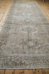 Distressed Karaja runner, showing textured pile, geometric patterns, and time-softened neutral tones.
