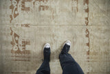 Distressed vintage Oushak rug runner features heavy abrashes and faded Samovar style floral motifs.