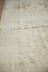 Distressed vintage Oushak rug pile with faded coffee brown Samovar floral motifs.