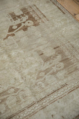 Distressed Oushak runner showcasing muted Samovar floral blossoms in pale coffee brown and silver tones.