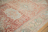Worn texture and a hidden bird motif on a vintage distressed Persian Karaja runner.