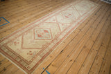Angled full-length view of a vintage Serab runner with a distressed triple diamond medallion design.