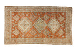 Distressed Heriz rug showcasing triple medallions, burnt orange, pale blue, ivory, 2'5