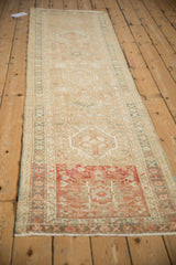 Geometric motifs and distinct brick red abrash on a distressed vintage Karaja rug runner.
