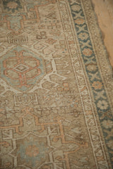 Distressed vintage Karaja rug runner pile, showing geometric patterns and abrash in beige and teal.