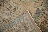 Secured side cord and hand-knotted foundation of a distressed vintage Tabriz carpet.