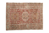 Vintage distressed Persian Karaja rug with a triple geometric medallion in brick red, slate blue, and ivory.