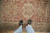 Showcasing the distressed wear and geometric pattern of a vintage Karaja rug underfoot.
