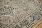 Distressed vintage Karaja rug corner, revealing geometric patterns and natural wear to foundation.