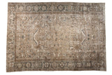 Distressed vintage Mehrivan carpet with an allover geometric pattern in beige, silver, and pale charcoal.
