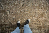 Mostly even wear and low pile texture of a vintage distressed Mehrivan with geometric floral designs.