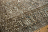 Close view of the Mehrivan carpet's mostly even wear and geometric Turtle Samovar border.