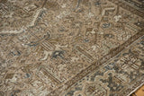 Angled view of the Turtle Samovar border and textured, low pile on a distressed Mehrivan carpet.