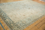 Angled view of a vintage Mehrivan carpet showing the Turtle Samovar border and abrashed field.