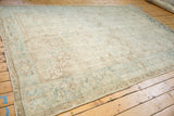 Low perspective view of a distressed Mehrivan rug, highlighting its soft palette and abrashes.
