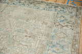 Distressed Mehrivan rug corner with an ivory field and a pale blue Turtle Samovar border.