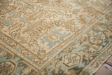 Low pile texture and Turtle Samovar border in slate blue and coffee brown on a vintage rug.