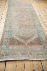 Secured end fringe and distressed pawn motif border on the vintage Serab runner.