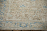 Distressed Heriz carpet border with meandering samovar turtle motif and faded blue accents.