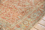Low-pile texture on the Samovar Turtle border of a distressed vintage Heriz carpet.