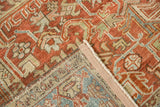 Corner detail showing the hand-knotted foundation and restored side cord of a vintage Heriz rug.
